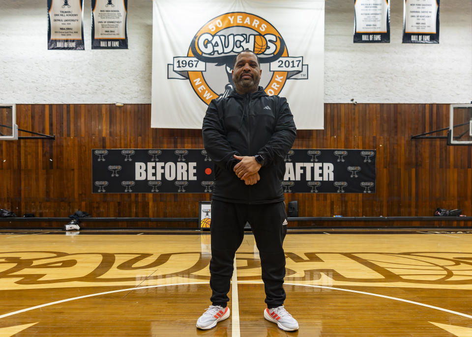 Book Richardson, director of the New York Gauchos boy's basketball program, poses for a portrait at the Gaucho Gym, Monday, March 11, 2024, in the Bronx borough of New York. Four assistant coaches arrested in a 2017 FBI probe designed to clean up college basketball are Black. All are out of the sport, banned by the NCAA. One coach, Book Richardson, tells The Associated Press he knows why: Because Black assistants were the low-hanging fruit — the ones on the front lines making connections with athletes who go on to play in college.(AP Photo/Peter K. Afriyie)