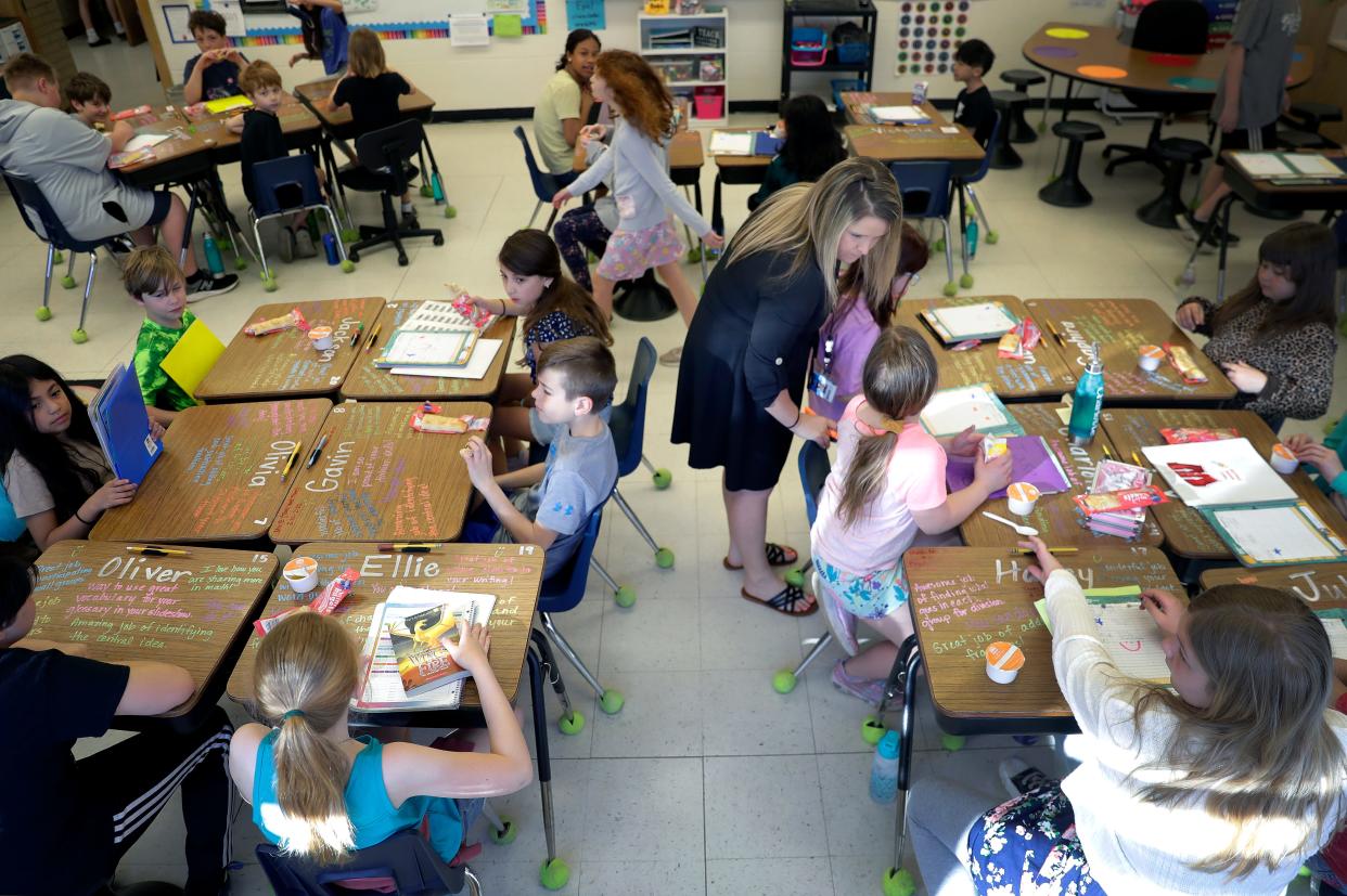 Fourth-grade teacher Brianna Weyers works with students during class in this 2023 file photo.
