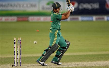 South Africa's Henry Davids is bowled during their second Twenty20 international cricket match against Pakistan in Dubai November 15, 2013. REUTERS/Nikhil Monteiro