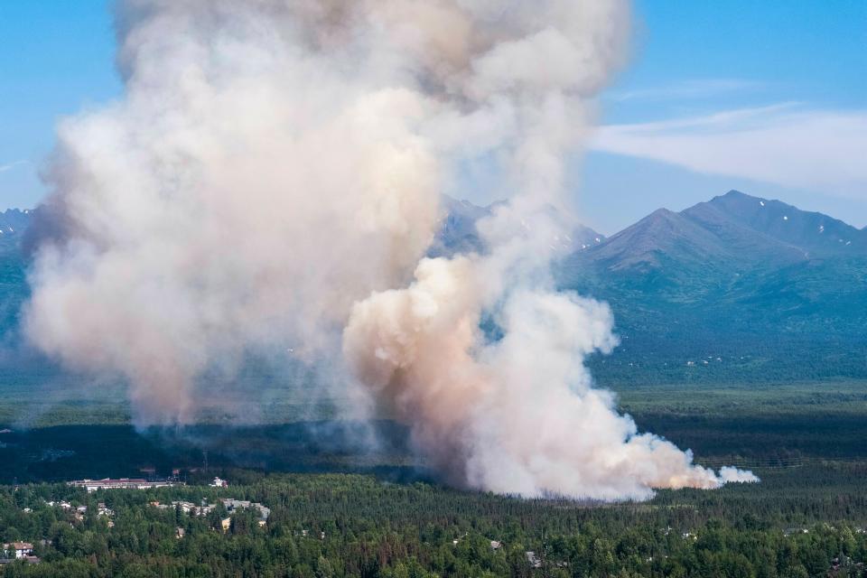 A brush fire burns in South Anchorage, Alaska, Tuesday, July 2, 2019.