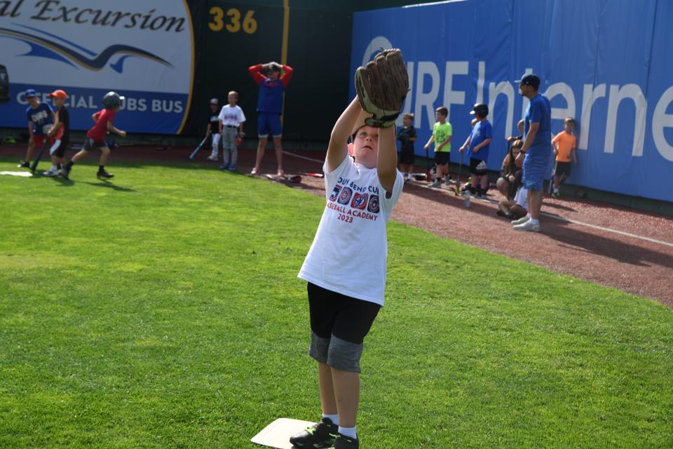 Chase Kucznanski, 8, makes a catch at baseball camp at Four Winds Field on Friday July 7, 2023.