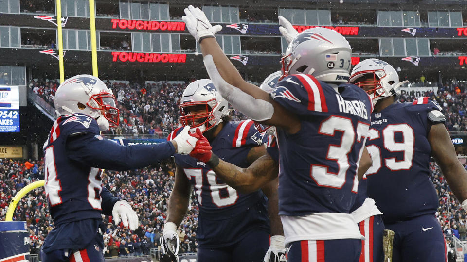 New England Patriots wide receiver Kendrick Bourne, left, is congratulated after his touchdown during the second half of an NFL football game against the Tennessee Titans, Sunday, Nov. 28, 2021, in Foxborough, Mass. (AP Photo/Steven Senne)