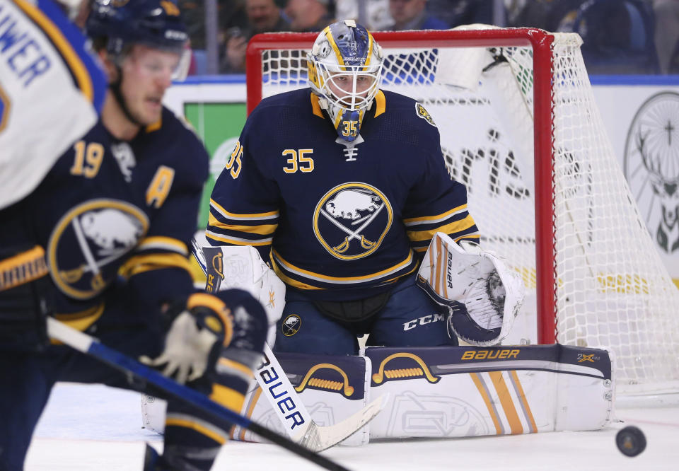 Buffalo Sabres goalie Linus Ullmark (35) keeps his eyes on the puck during the second period of an NHL hockey game against the St. Louis Blues, Tuesday, Dec. 10, 2019, in Buffalo, N.Y. (AP Photo/Jeffrey T. Barnes)