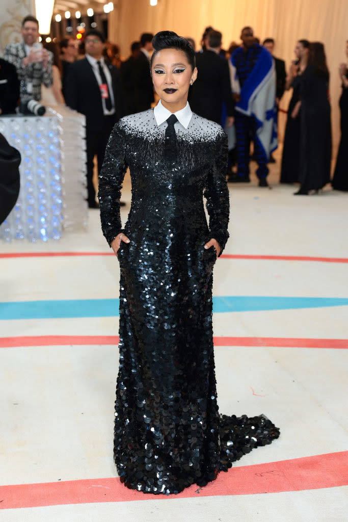 Stephanie Hsu attends The 2023 Met Gala in a glittering gown