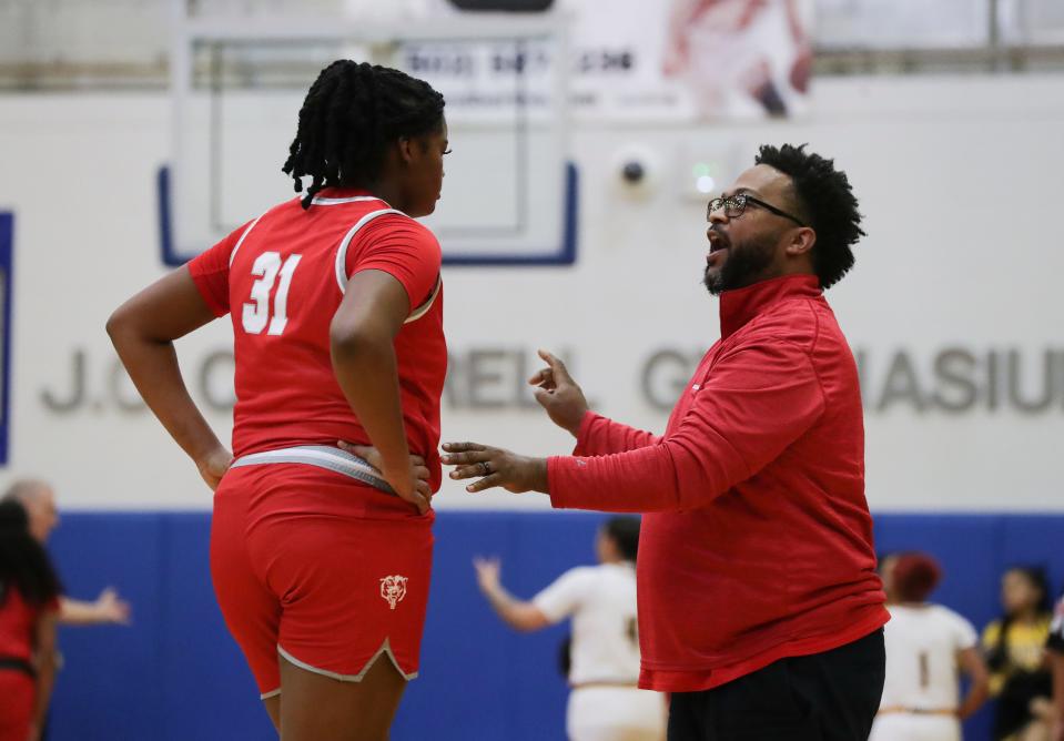 Butler head coach DeMarcus Avery instructed Ramiya White (31) during the Girls LIT at the Valley High School gym in Louisville, Ky. on Jan. 24, 2023.  