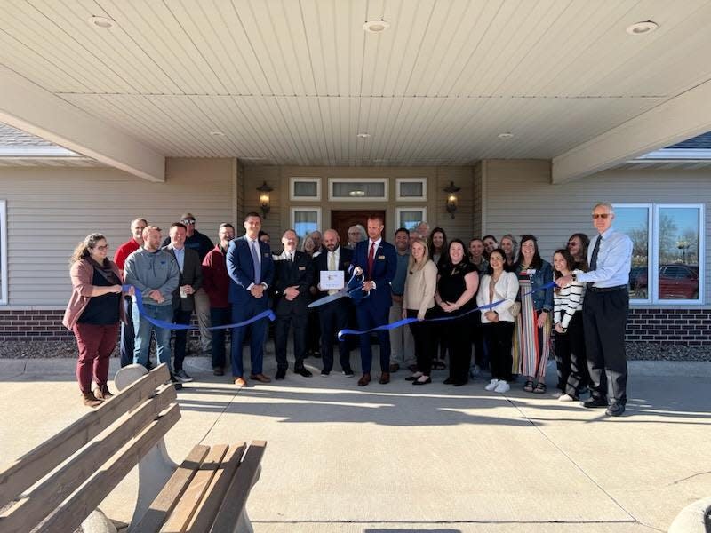 The ribbon is cut on Thursday, April 11, 2024, at Caldwell Parrish Funeral Home in Perry.