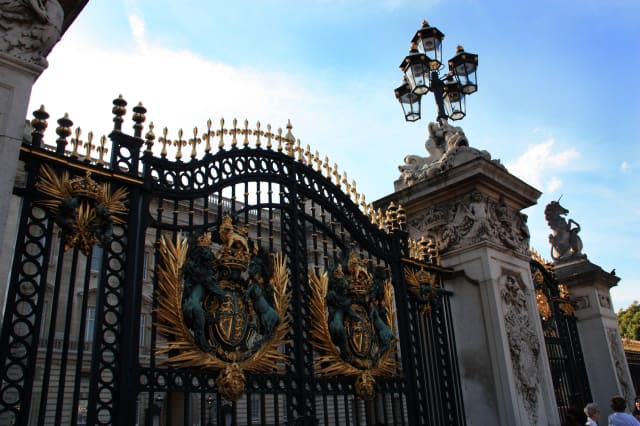 Ornate main gate with royal coat of arms at Buckingham Palace, London, United Kingdom