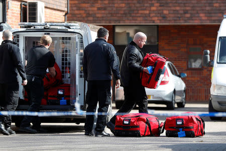 Police officers prepare equipment as inspectors from the Prohibition of Chemical Weapons (OPCW) begin work at the scene of the nerve agent attack on former Russian agent Sergei Skripal, in Salisbury (REUTERS)