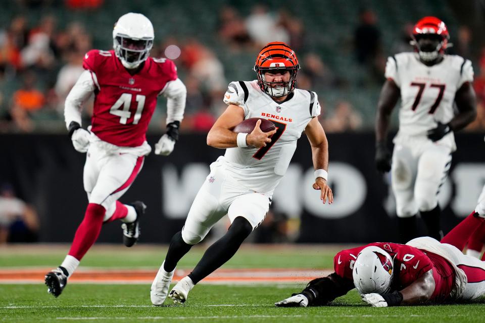 Cincinnati Bengals quarterback Drew Plitt (7) holds on the the ball for a run in the fourth quarter of an NFL preseason game between the Cincinnati Bengals and Arizona Cardinals at Paycor Stadium.