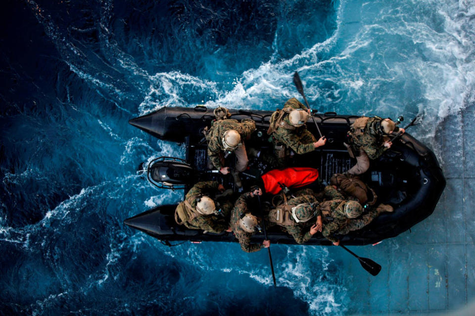 Marines with the 15th Marine Expeditionary Unit Maritime Raid Force depart the USS Essex (LHD 2) on a combat rubber raiding craft during Amphibious Squadron Three/Marine Expeditionary Unit Integration Training (PMINT) off the coast of San Diego March 4, 2015. 