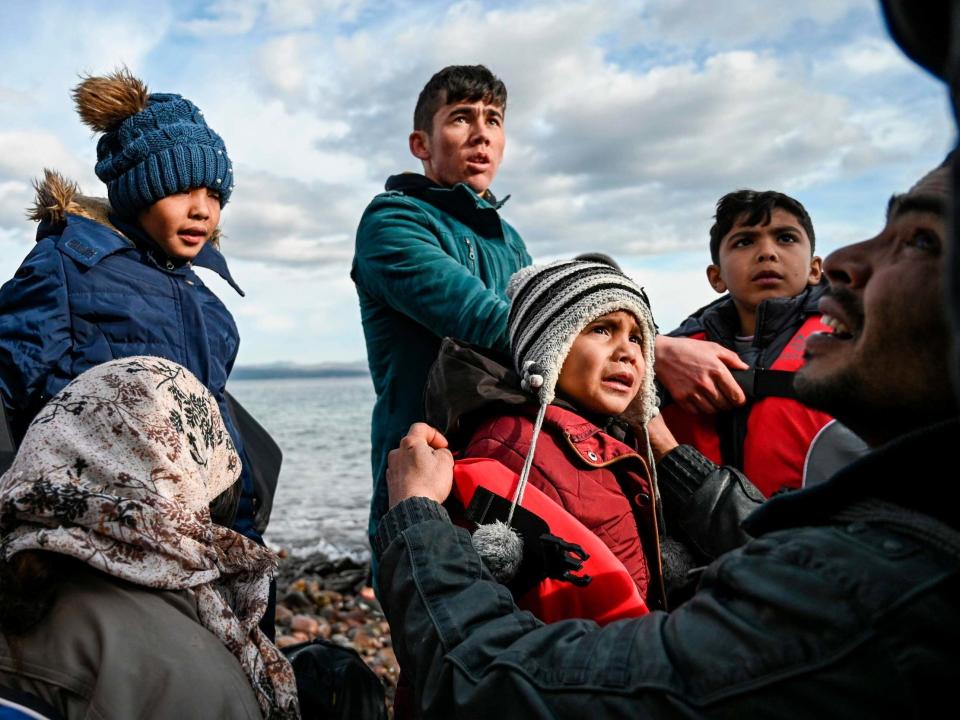 Afghan refugees disembark from a dinghy on the Greek island of Lesbos: AFP via Getty Images