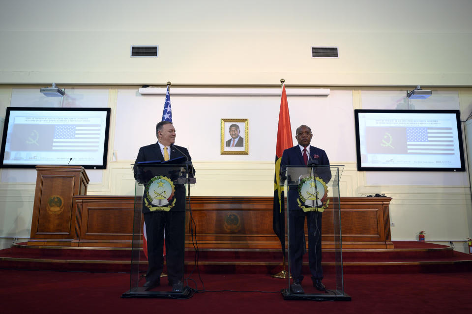 US Secretary of State, Mike Pompeo, left, and Angola Foreign Minister, Manuel Domingos Augusto hold a press conference in Luanda, Angola, Monday Feb. 17, 2020. Pompeo started his tour of Africa in Senegal, the first U.S. Cabinet official to visit in more than 18 months. He left Senegal Sunday to arrive in Angola and will then travel on to Ethiopia as the Trump administration tries to counter the growing interest of China, Russia and other global powers in Africa and its booming young population of more than 1.2 billion. (Andrew Caballero-Reynolds/Pool via AP)