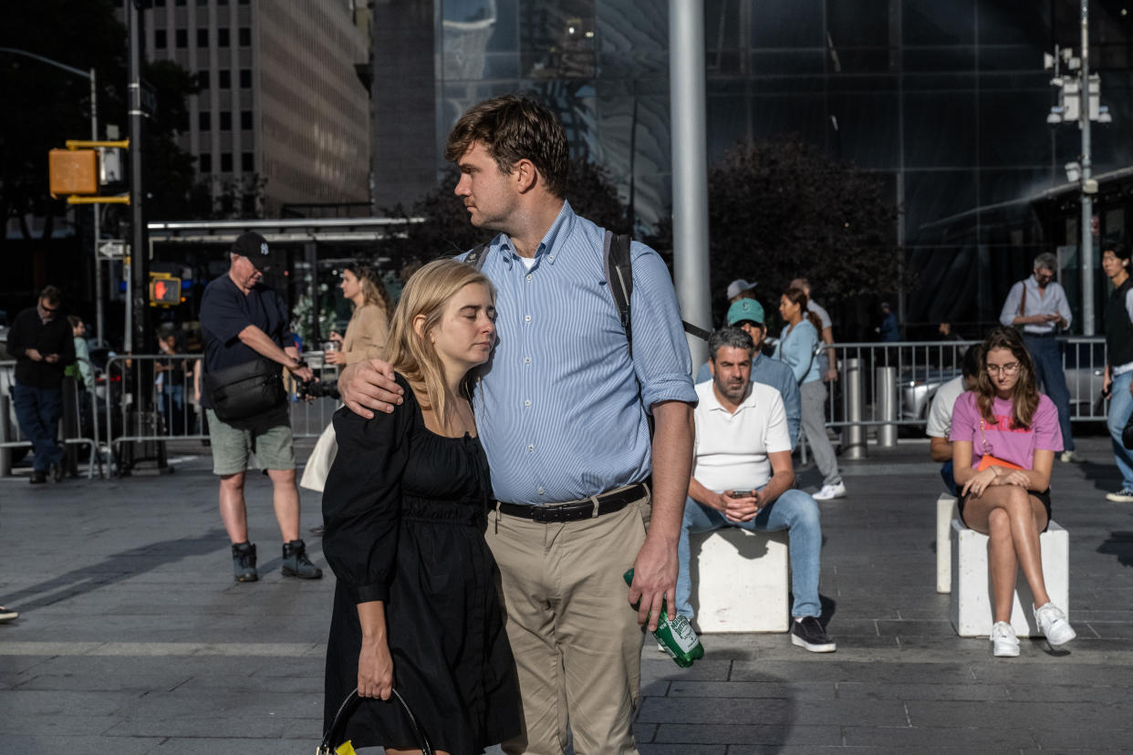 People gather at the 9/11 Memorial site.