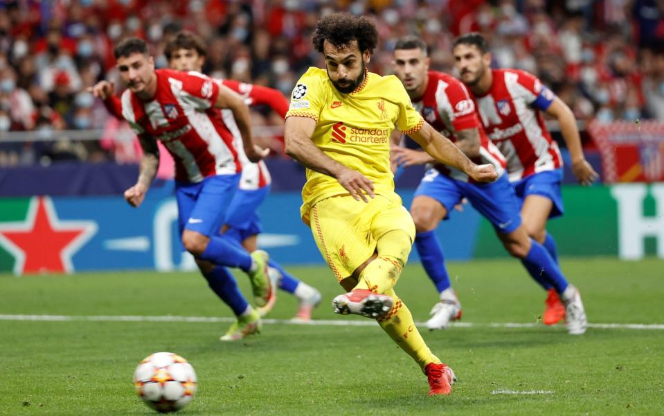 Liverpool's striker Mohamed Salah scores the 3-2 lead from the penalty spot during the UEFA Champions League group B soccer match between Atletico Madrid and Liverpool FC at Wanda Metropolitano stadium in Madrid, Spain, 19 October 2021. - Chema Moya/EPA-EFE/Shutterstock