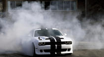 A driver warms up before a race at Bandimere Speedway west of Denver on May 5, 2021. The Colorado State Patrol runs a program called "Take it to the Track" in hopes of luring racers away from public areas to a safer and more controlled environment, even allowing participants to race a trooper driving a patrol car. The program's goals have gained new importance and urgency this year as illegal street racing has increased amid the coronavirus pandemic. (AP Photo/Thomas Peipert)