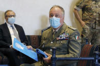 The Head of Mission and Force Commander of the United Nations Interim Force in Lebanon (UNIFIL), Major-General Stefano Del Col from Italy, right, listens as Lebanese Parliament Speaker Nabih Berri, speaks during a news conference, in Beirut, Lebanon, Thursday, Oct. 1, 2020. Berri announced Thursday that an agreement has been reached on a framework of indirect talks between Lebanon and Israel over the longstanding disputed maritime border between the two countries. (AP Photo / Bilal Hussein)