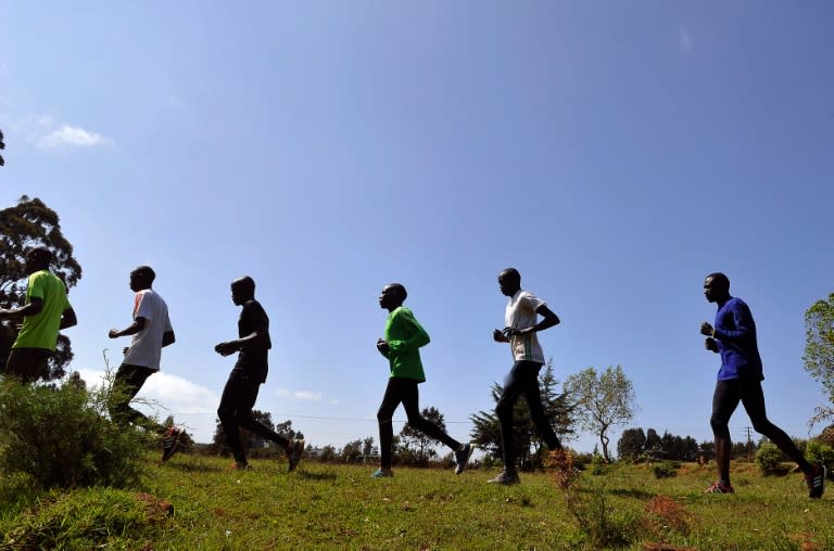 David Rudisha (right) and other Kenyan athletes train in Iten in the Rift Valley, 329 km north of Nairobi, on January 13, 2016