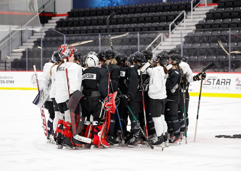 PWHL Toronto players gather after a practice in Utica, N.Y., on Sunday.