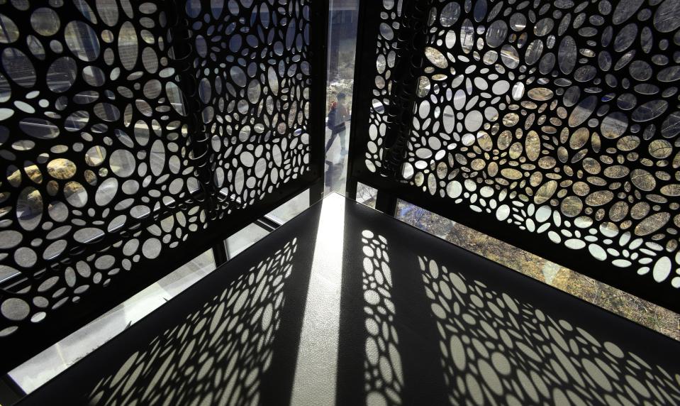 Long shadows in the stairwell of the Tilden Arts Center at Cape Cod Community College in West Barnstable as a student is framed up in the decorative railings as March arrived like a lamb across Cape Cod. 
Steve Heaslip/Cape Cod Times