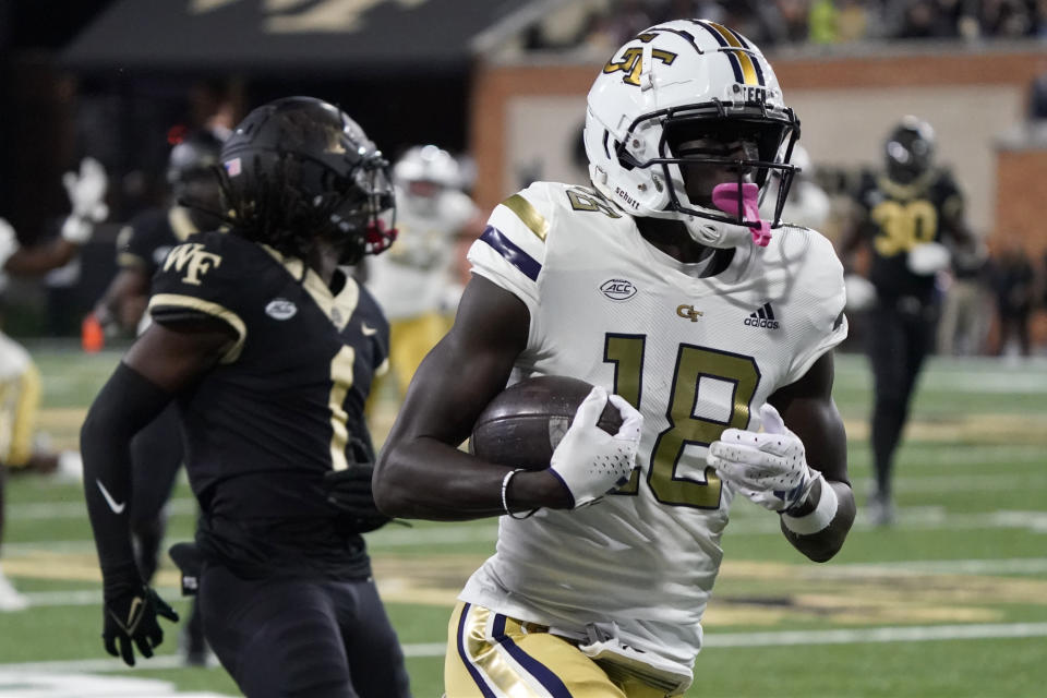 Georgia Tech wide receiver Abdul Janneh (18) runs into the end zone for a touchdown after a catch against Wake Forest defensive back Caelen Carson (1) during the first half of an NCAA college football game in Winston-Salem, N.C., Saturday, Sept. 23, 2023. (AP Photo/Chuck Burton)