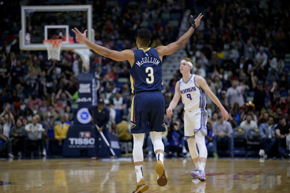 New Orleans Pelicans guard CJ McCollum (3) celebrates a three point basket next to Sacramento Kings guard Kevin Huerter (9) in the first half of an NBA basketball game in New Orleans, Sunday, Feb. 5, 2023. (AP Photo/Matthew Hinton)