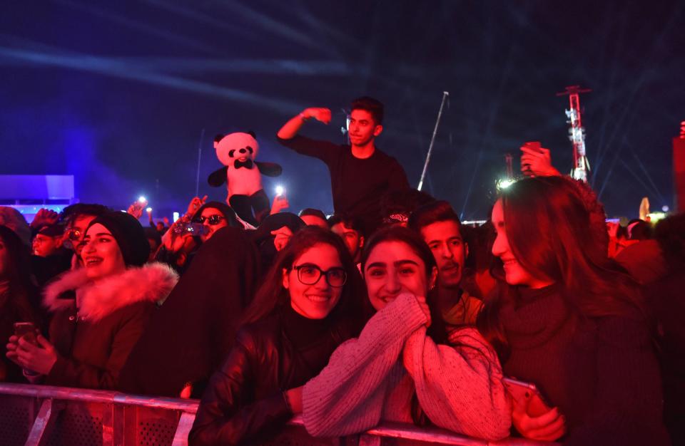 Saudi fans attend the "MDL Beast Fest", an electronic music festival, held in Banban on the outskirts of the Saudi capital Riyadh on December 19, 2019. - Saudi Arabia's de facto ruler, Crown Prince Mohammed bin Salman, Prince Mohammed has sought to shake off his country's ultra-conservative image -- lifting a ban on cinemas and women drivers while allowing gender-mixed concerts and sporting extravaganzas. The relaxed social norms in a kingdom have been welcomed by many Saudis, two-thirds of whom are under 30. (Photo by Fayez Nureldine / AFP) (Photo by FAYEZ NURELDINE/AFP via Getty Images)