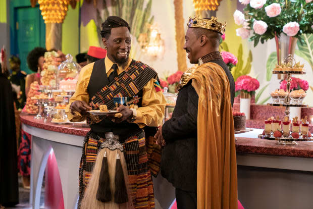 General Izzi (Wesley Snipes) and King Akeem catch up at the buffet.