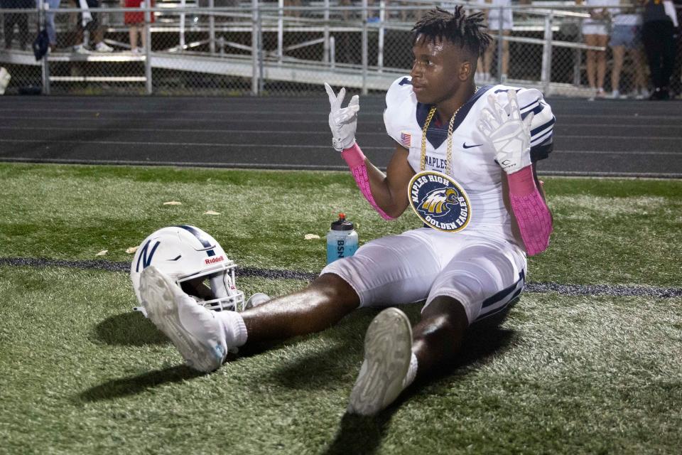 Naples' Kerry Brown (1) celebrates during a Florida 6A District 14 high school football game between Naples and Barron Collier, Friday, Oct. 1, 2021, at Barron Collier High School in Naples, Fla.Naples led Barron Collier 47-0 at halftime and won 61-0.