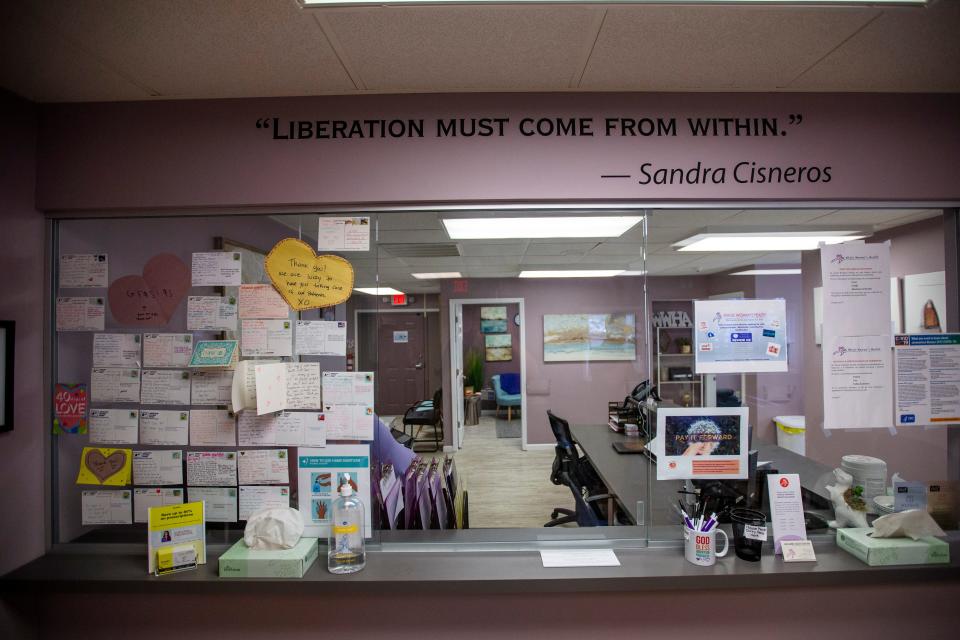 The walls of the Whole Woman's Health South Bend clinic are adorned with messages of empowerment given by women. "Liberation must come from within," a message above the reception desk reads.