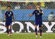 Japan's Shinji Kagawa reacts after Colombia's second goal scored by Colombia's Jackson Martinez during their 2014 World Cup Group C soccer match at the Pantanal arena in Cuiaba June 24, 2014. REUTERS/Dylan Martinez (BRAZIL - Tags: TPX IMAGES OF THE DAY SOCCER SPORT WORLD CUP)