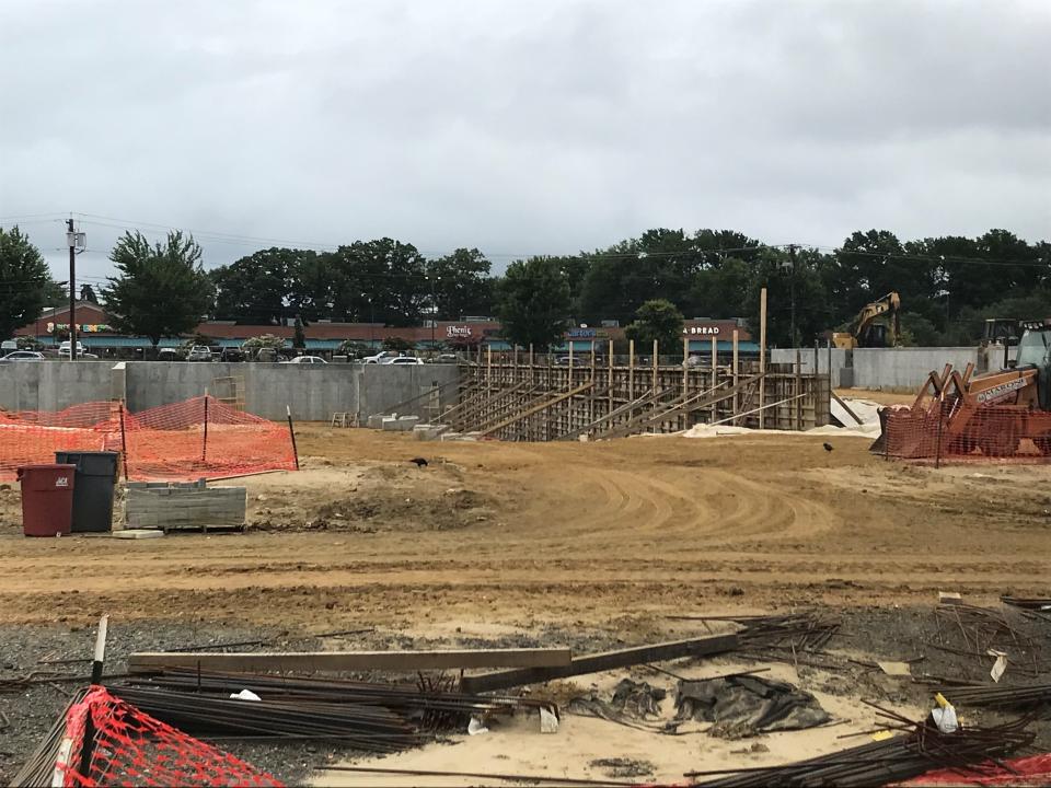 An apartment complex with 375 units and including an affordable housing component  is in a very early construction stage at Moorestown Mall. Shown are the first sections of the parking garage foundation amidst site-wide earth excavation.