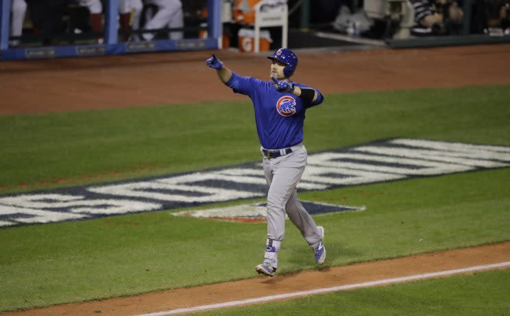 Chicago Cubs' David Ross celebrates his home run during the sixth inning of Game 7 of the Major League Baseball World Series against the Cleveland Indians Wednesday, Nov. 2, 2016, in Cleveland. (AP Photo/Gene J. Puskar)