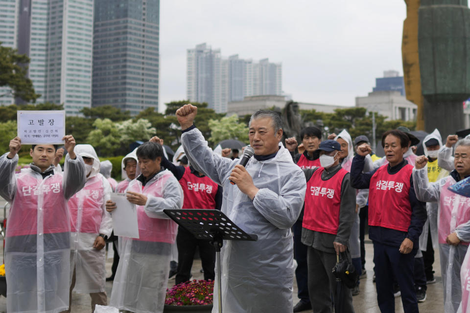 FILE - Ju Yeongbong, an official at an association of dog farmers, center, shouts slogans with other members during a rally in Seoul, South Korea on April 25, 2023. Ju Yeongbong, an official of the farmers’ association, said farmers want to continue for about 20 more years until older people, their main customers, die, allowing the industry to naturally disappear. Observers say most farmers are also in their 60s to 70s. (AP Photo/Lee Jin-man, File)