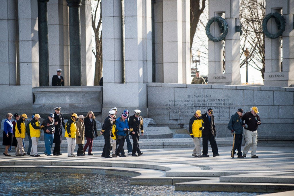 National Park Service volunteers escort WWII veterans to a wreath laying ceremony held by the Friends of the National World War II Memorial and the National Park Service in this file photo from December 7, 2017. The memorial is one of the many sites within the National Park System with military ties.