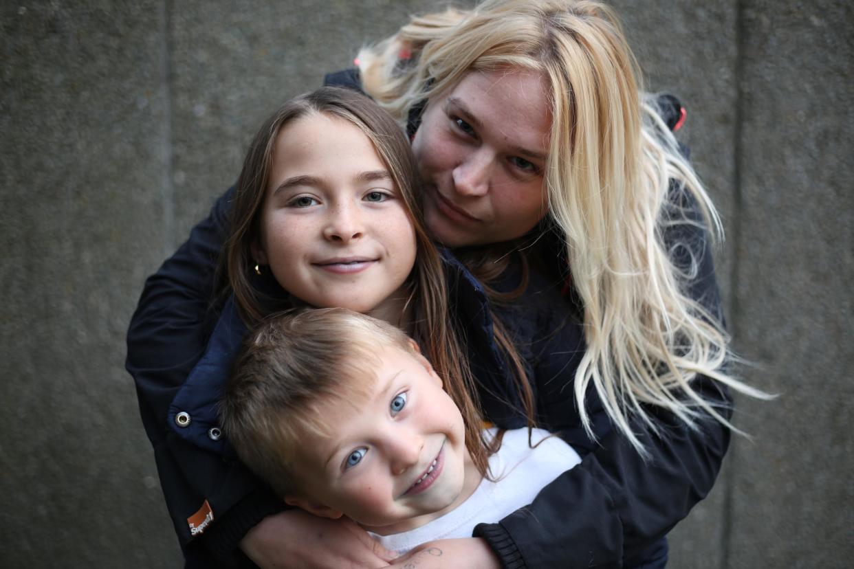 The two children, pictured with their mother Charlotte, 30, are forced to live on £5 a day while they wait for their Universal Credit to come through. (Channel 4)