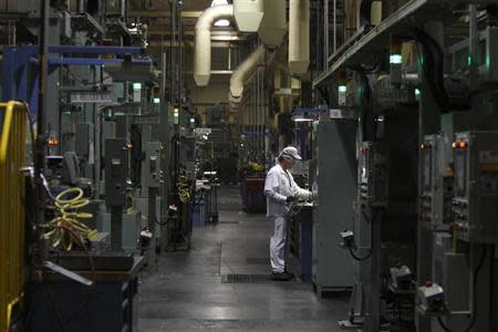 An associate is seen working in the connecting rod area during a tour of the Honda automotive engine plant in Anna, Ohio October 11, 2012. REUTERS/Paul Vernon