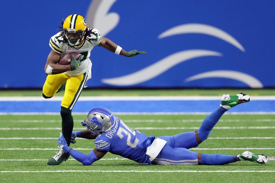 Detroit Lions' Amani Oruwariye attempts to tackle Green Bay Packers' Davante Adams during the first quarter at Ford Field, Dec. 13, 2020.