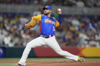 Venezuela's Martin Perez delivers a pitch during the first inning of a World Baseball Classic game against the U.S., Saturday, March 18, 2023, in Miami. (AP Photo/Wilfredo Lee)