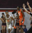 Virginia Tech's Jalen Cone (15) celebrates making a 3-point basket against Syracuse during the first half of an NCAA college basketball game in Blacksburg Va., Saturday, Jan. 18 2020. (Matt Gentry/The Roanoke Times via AP)