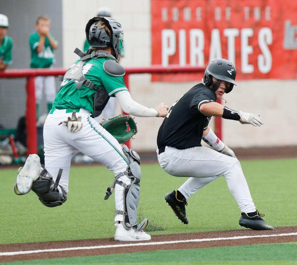 Bushland’s Jaxon Fetsch (2) is tagged out in a run down by Wall’s Gunnar Dillard (24) in the second inning in the rubber match of a best-of-three Region I-3A semifinal series Saturday, May 27, 2023, at Lubbock-Cooper’s Pirate Field at First United Park.