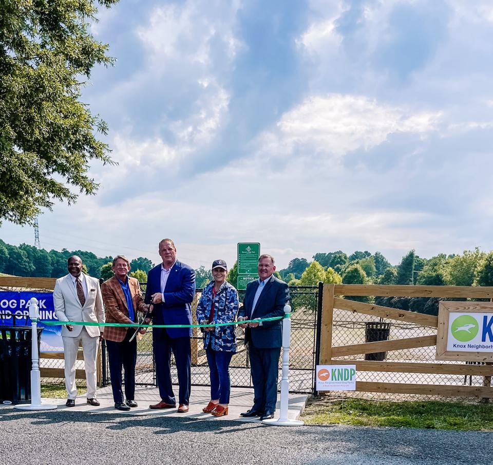 Joe Mack, senior director of Knox County Parks and Recreation, Randy Boyd and Knox County Mayor Glenn Jacobs are joined by elected officials for the Beverly Dog Park ribbon cutting event on June 29, 2022.