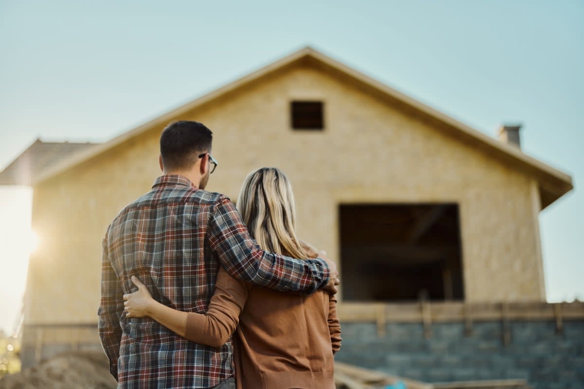 Couple looking at developing home