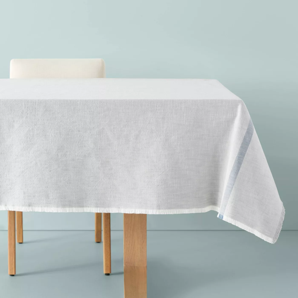 wooden table with grey tablecloth