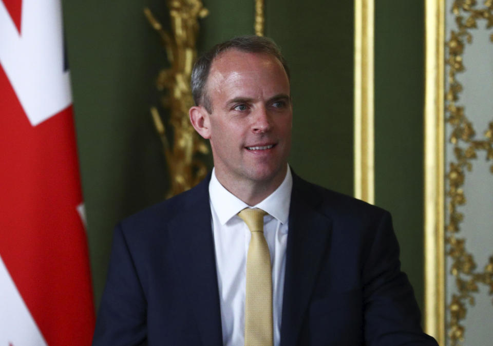 Britain's Foreign Secretary Dominic Raab speaks to the media, with United States Secretary of State, Mike Pompeo, at Lancaster House, London, Tuesday July 21, 2020, following their private meetings. Pompeo is meeting with British Prime Minister Boris Johnson and Foreign Secretary Domnic Raab just hours after Britain suspended its extradition treaty with Hong Kong and blocked arms sales to the former British territory after China imposed a tough new national security law. (Hannah McKay/Pool via AP)