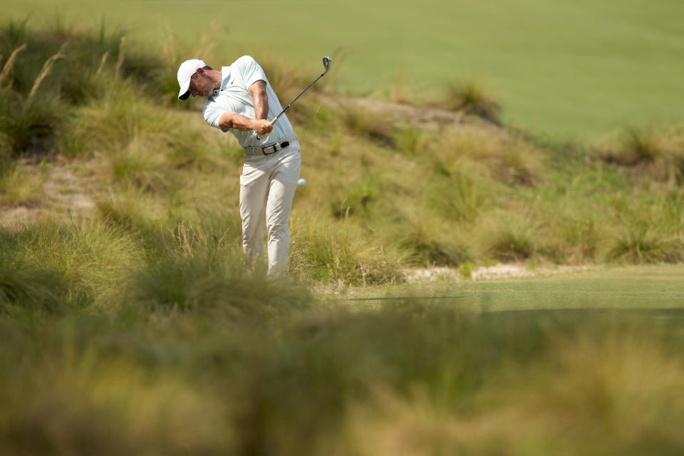 Rory McIlroy, of Northern Ireland, hits from the fairway on the 10th hole during the final round of the U.S. Open golf tournament Sunday, June 16, 2024, in Pinehurst, N.C. (AP Photo/Matt York)