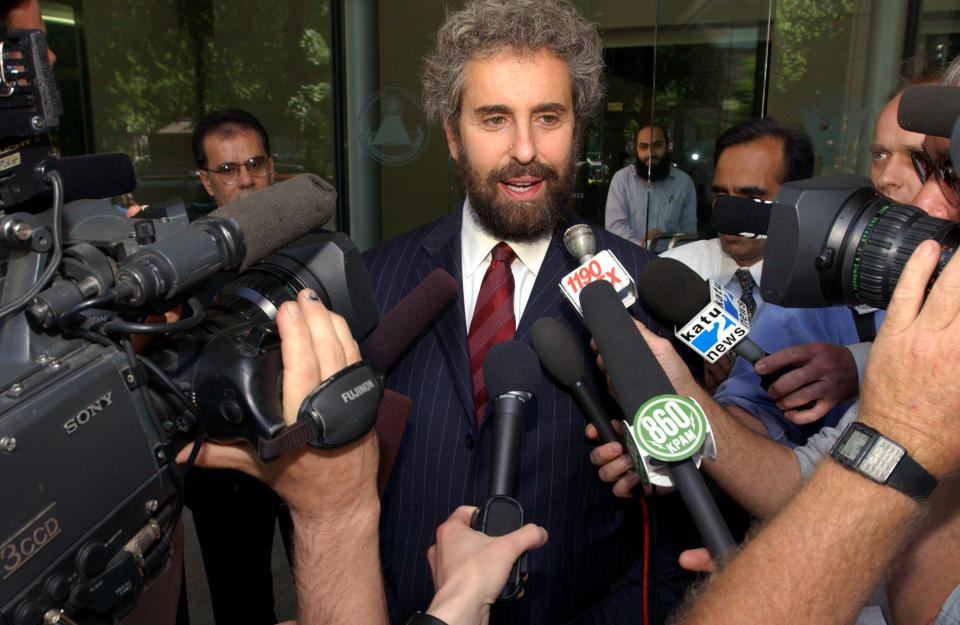 FILE - In this May 29, 2003, file photo, attorney Stanley Cohen, center, speaks to reporters on the steps of the Federal Courthouse in Portland, Oregon after his client, Mohamed Kariye, who pleaded guilty to minor fraud charges on March 3, received a sentence of five years probation. It can be an uncomfortable life for any defense attorney representing unpopular clients, but lawyers who agree to speak on behalf of people accused of plotting to kill Americans in terrorist attacks walk difficult road. “You get stigmatized. Folks avoid you. Cohen says, "You get ostracized. It’s terrible for a mate to see terrible publicity, to see you vilified, to avoid social settings because you know it will lead to confrontations.” (AP Photo/Greg Wahl-Stephens, File)