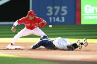 Tampa Bay Rays' Yandy Diaz, bottom, slides safely into second base with a double ahead of a tag by Toronto Blue Jays shortstop Santiago Espinal during the first inning of the second baseball game of a doubleheader Saturday, July 2, 2022, in Toronto. (Jon Blacker/The Canadian Press via AP)