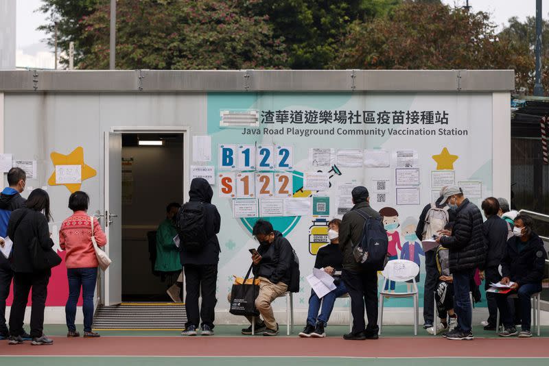 People queue at a community vaccination centre, ahead of an expected border reopening with China, during the coronavirus disease (COVID-19) pandemic in Hong Kong