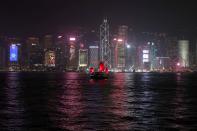 FILE PHOTO: The Hong Kong skyline is lit up on Christmas Eve in Hong Kong