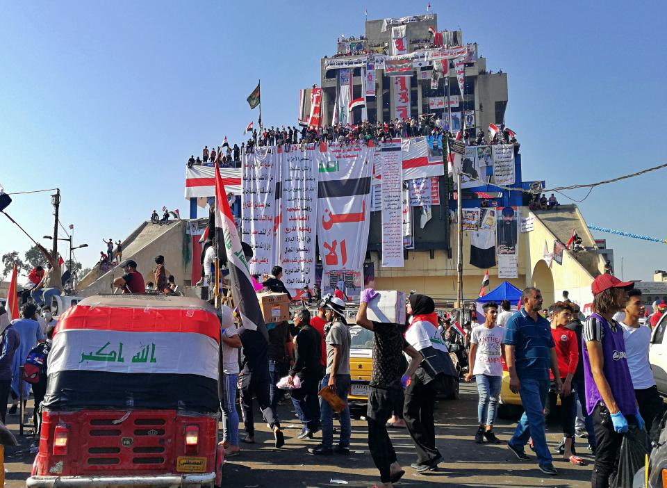 Anti-government protesters gather in Tahrir Square during ongoing protests in Baghdad, Iraq, Friday, Nov. 1, 2019. (AP Photo/Khalid Mohammed)